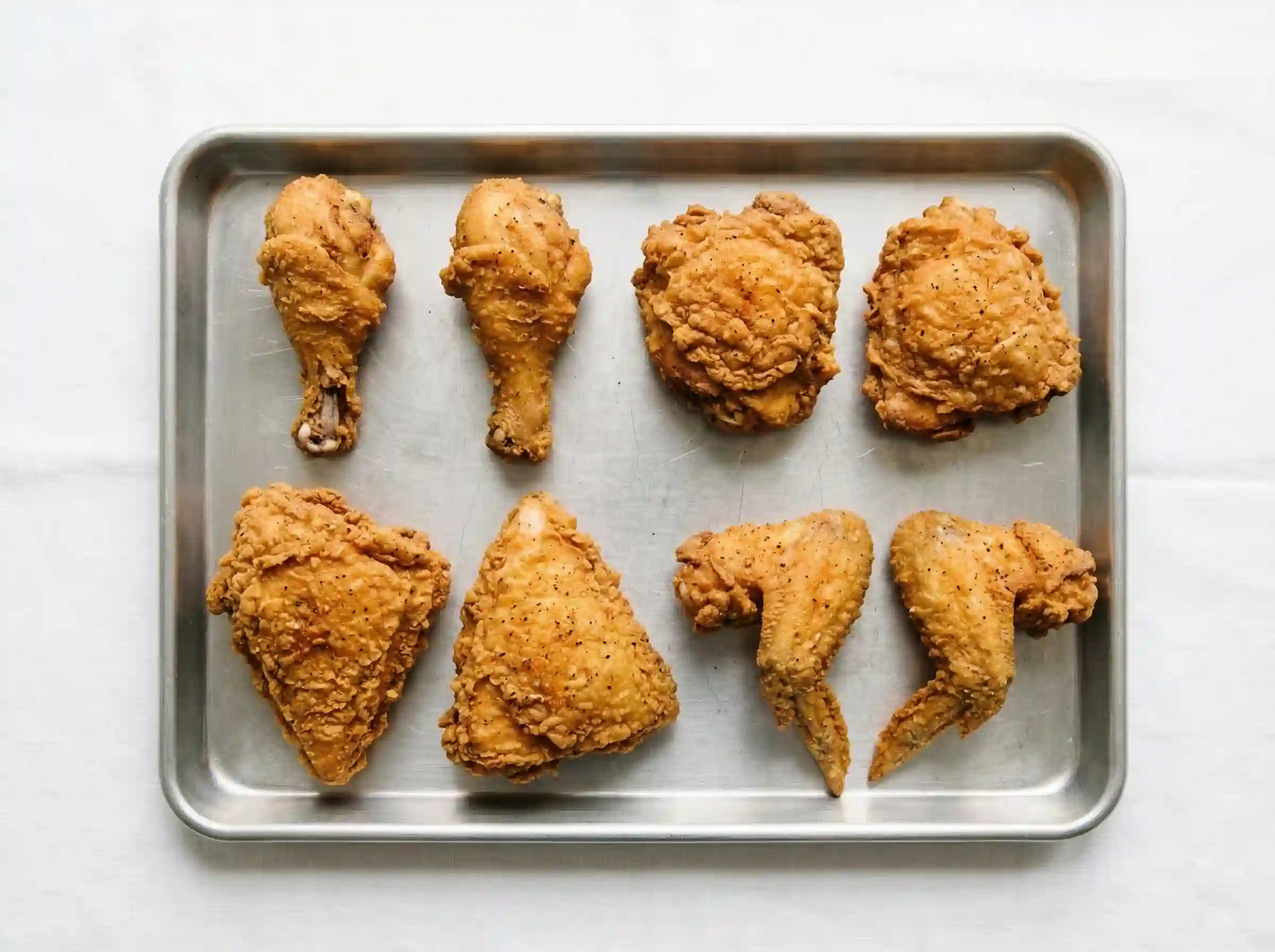KFC 8 piece chicken bucket pieces breakdown with 2 drumsticks 2 thighs 2 breasts and 2 wings