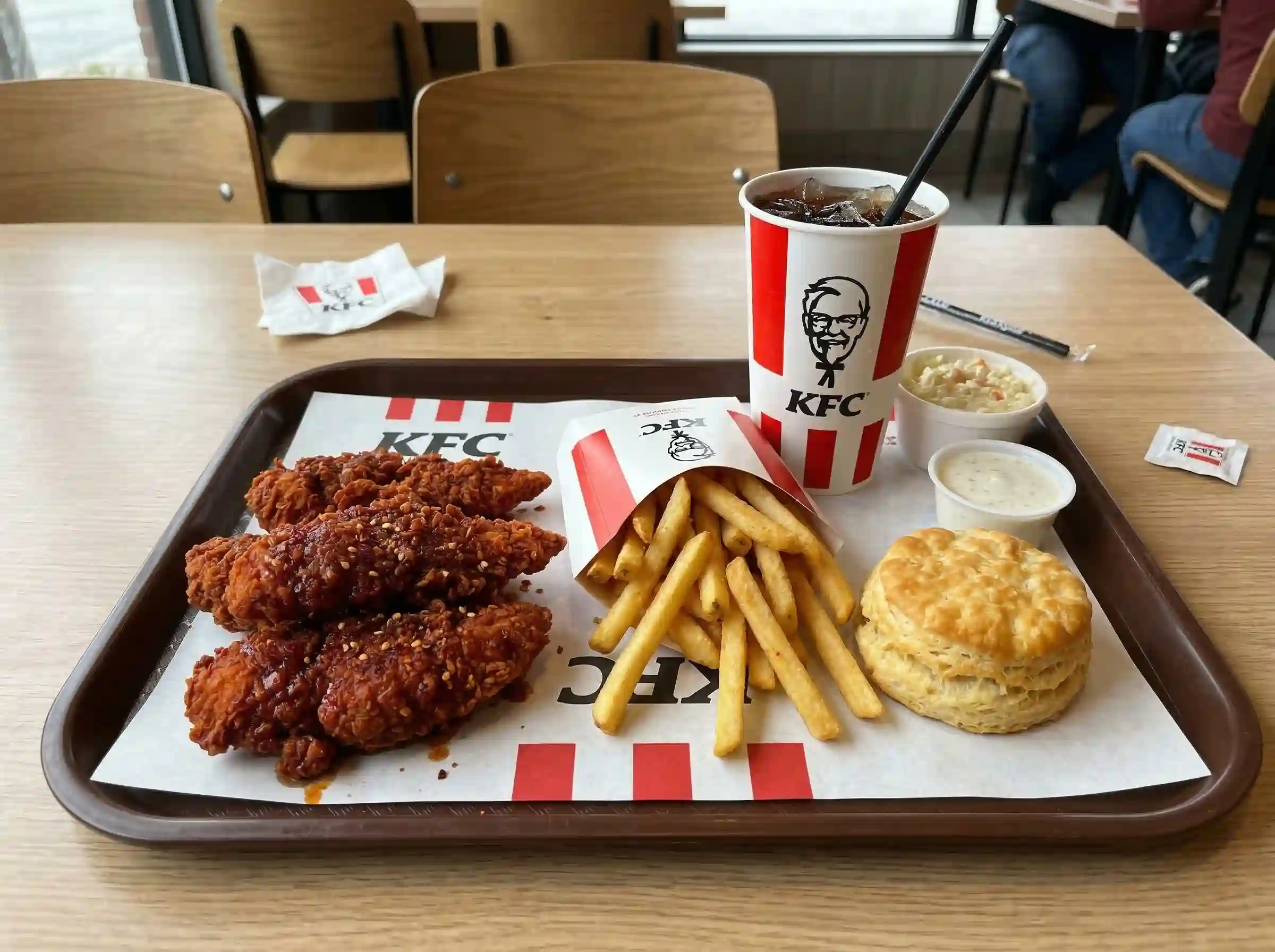 KFC Nashville Hot Tenders combo meal with fries biscuit and drink